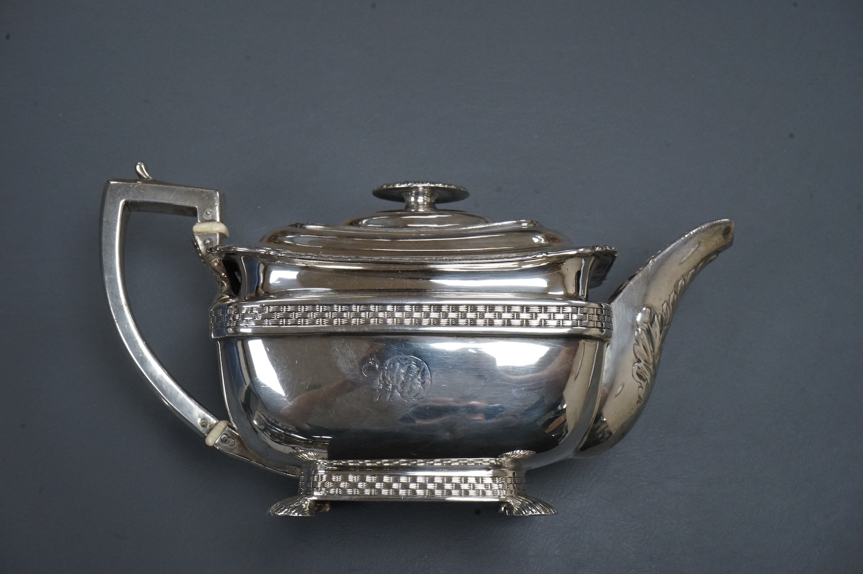 A George III silver oblong teapot by Daniel Pontifex, London, 1809, decorated with 'basket weave' bands, gross weight 26,2oz., CITES Submission reference, 712SNDFP